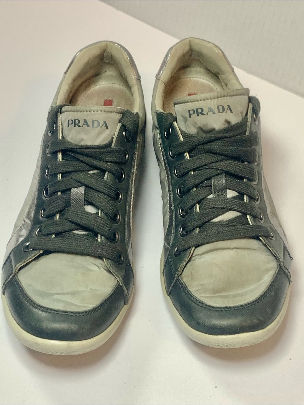 Prada Menโs Low-Top Sneakers in Black and Cream